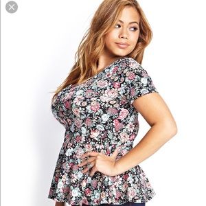 Used. Peplum top. Multi color.